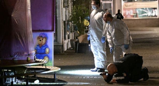 Forensic police inspect on early August 24 2024 the area where at least three people were killed an