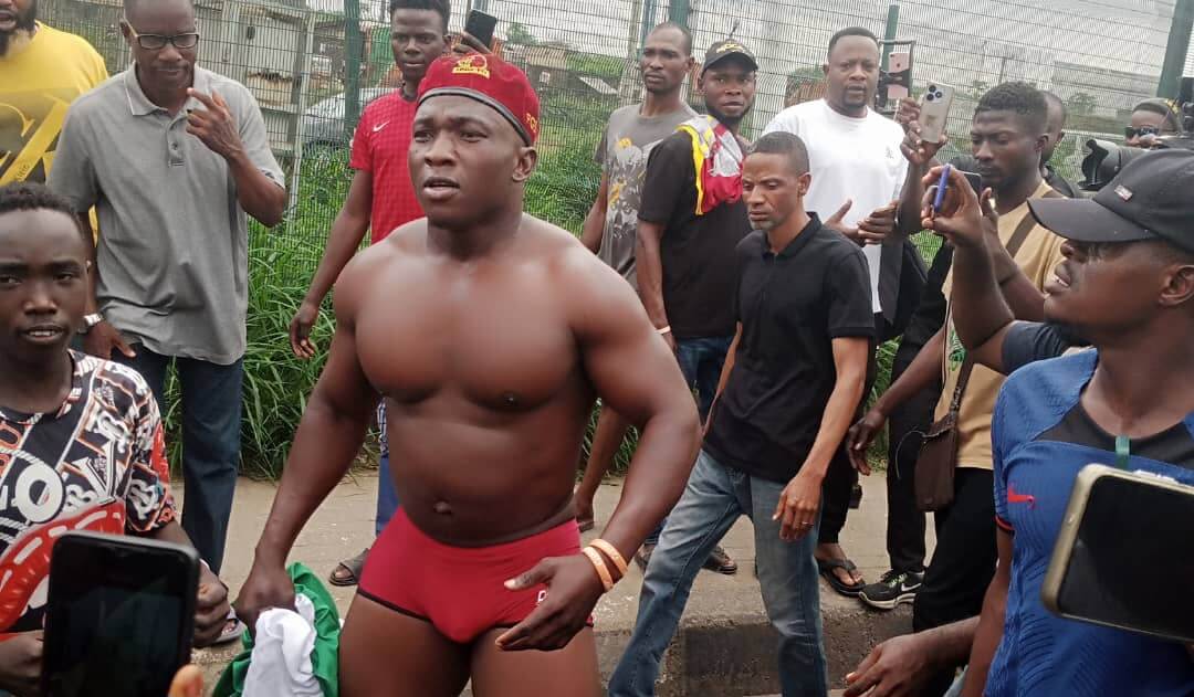 Protester Goes Half Naked In Lagos