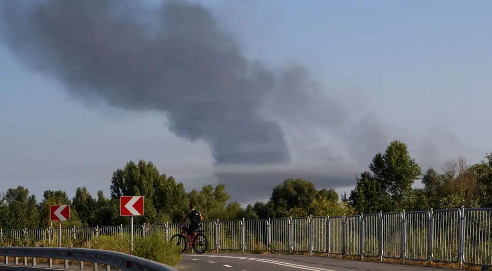 Smoke rises from the citys outskirts during a Russian missile and drone strike across Kyiv on Monday