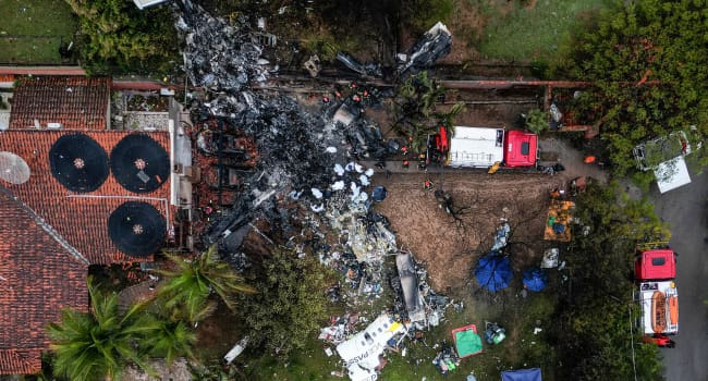 This photo shows an aerial view of the wreckage of an airplane that crashed with 61 people on board