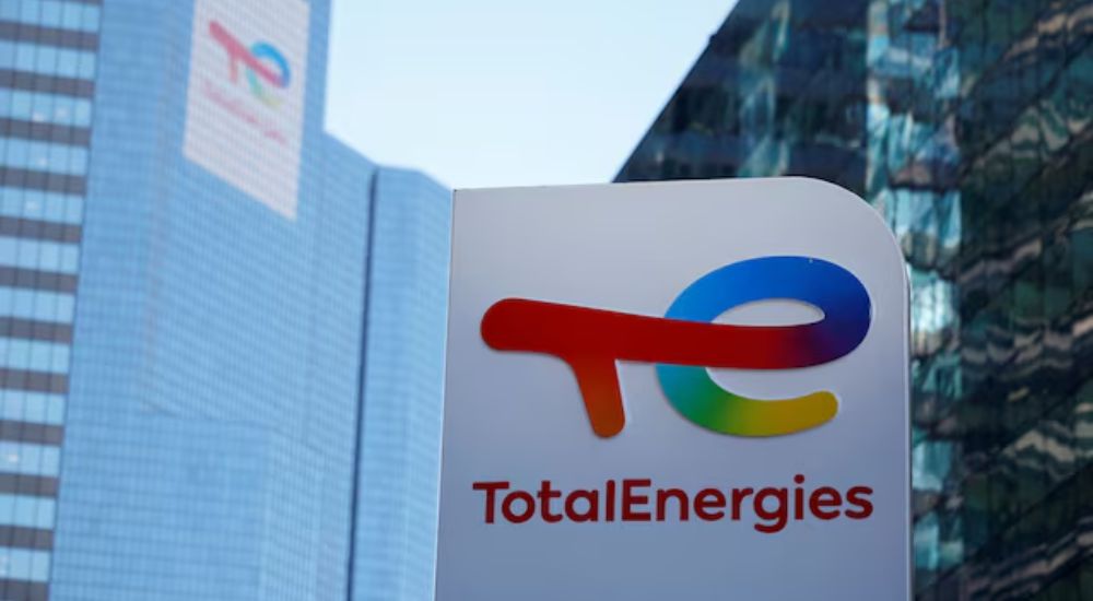 A logo of TotalEnergies is seen at an electric vehicle fuelling station in the La Defense business d