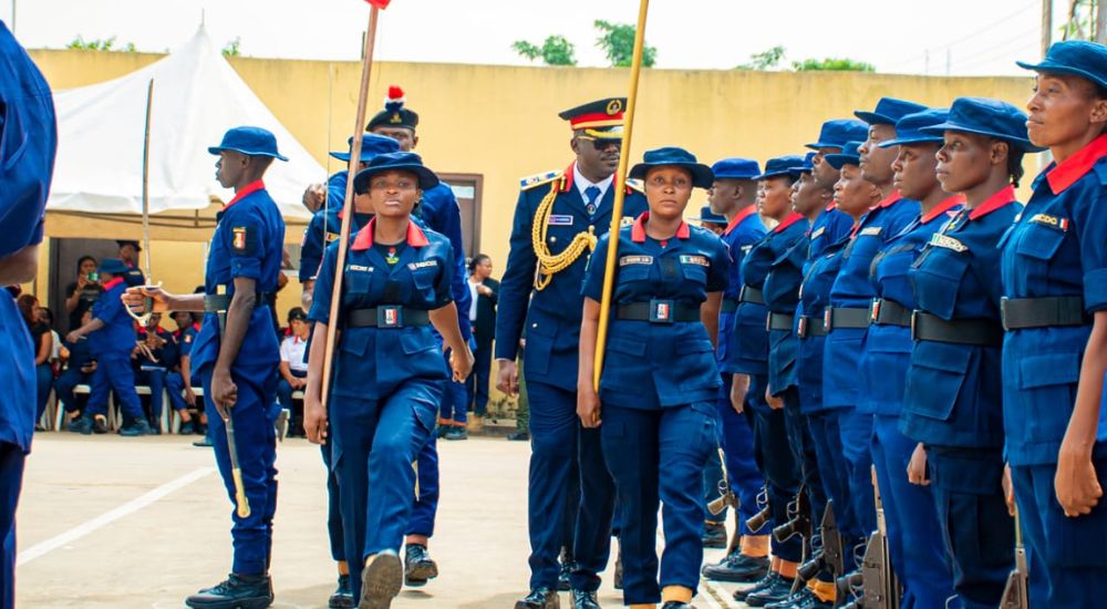 Commandant of the NSCDC FCT Command Dr. Olusola Odumosu inspecting personnel during parade