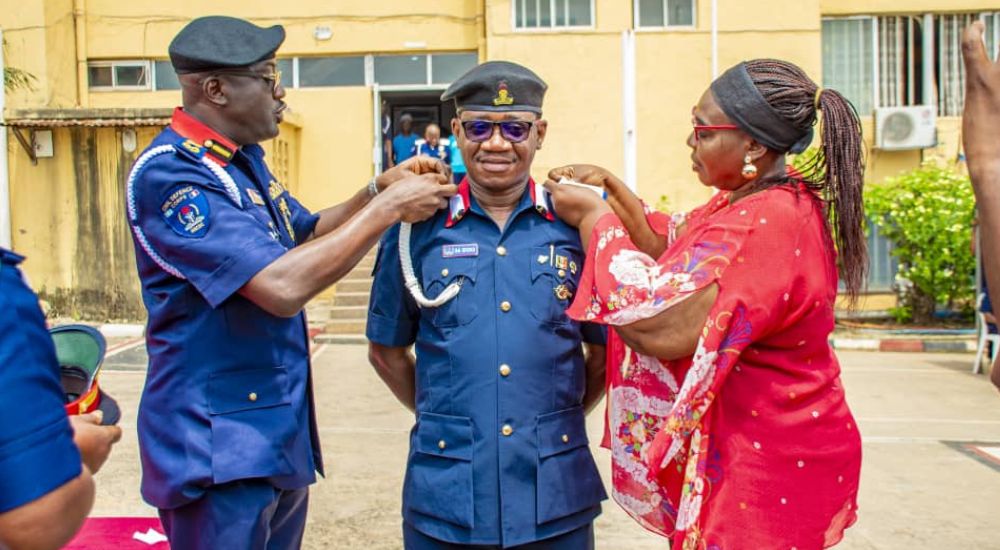 FCT NSCDC Commandant Olusola Odumosu decorating the command PRO Samuel Idoko