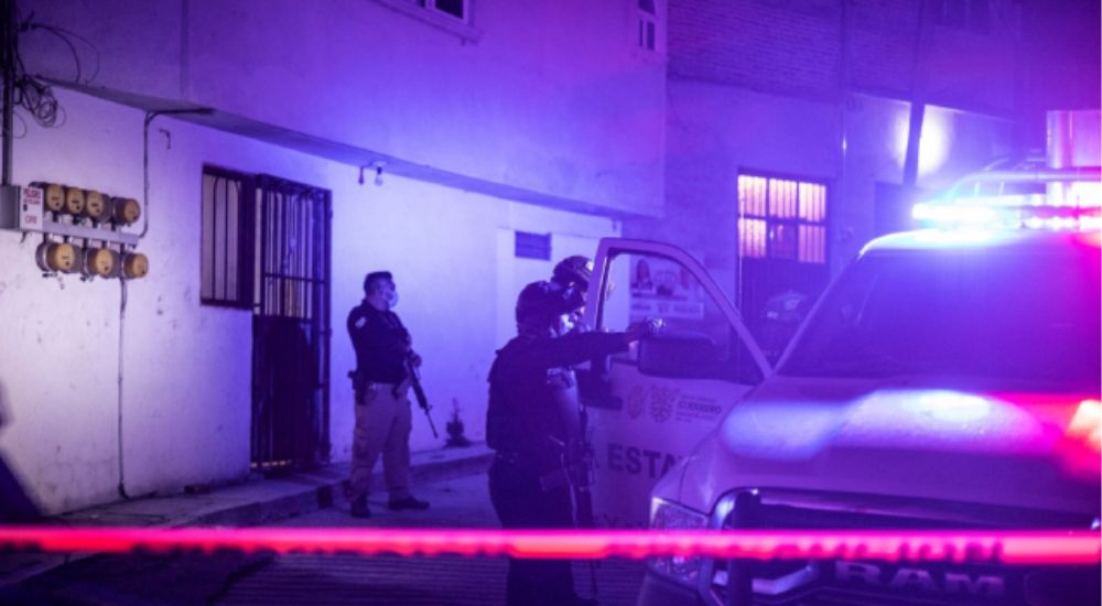 Investigators and forensic personnel work at the crime scene where remains of Chilpancingo Mayor Ale