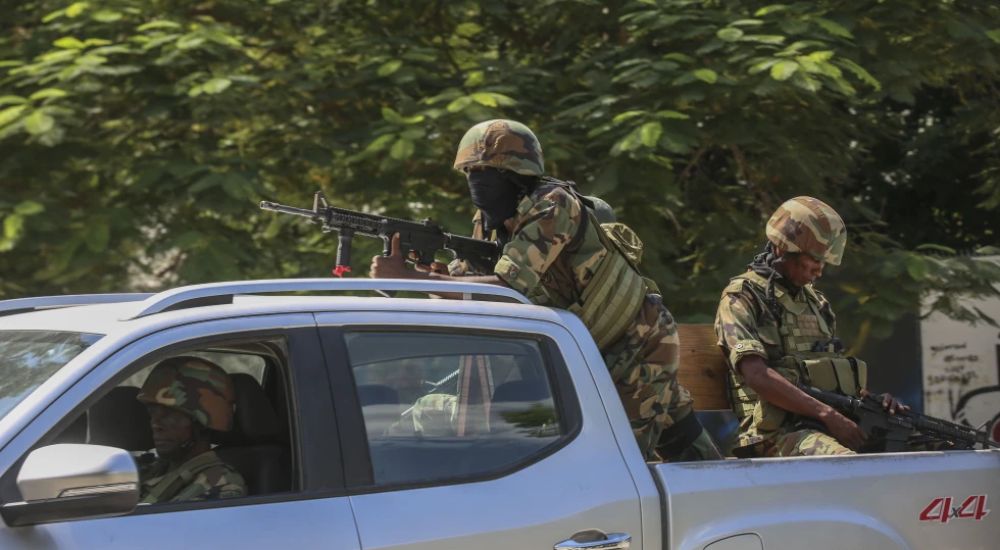 Soldiers patrol amid the sound of gunshots heard in the distance in Port au Prince Haiti Thursday Oc