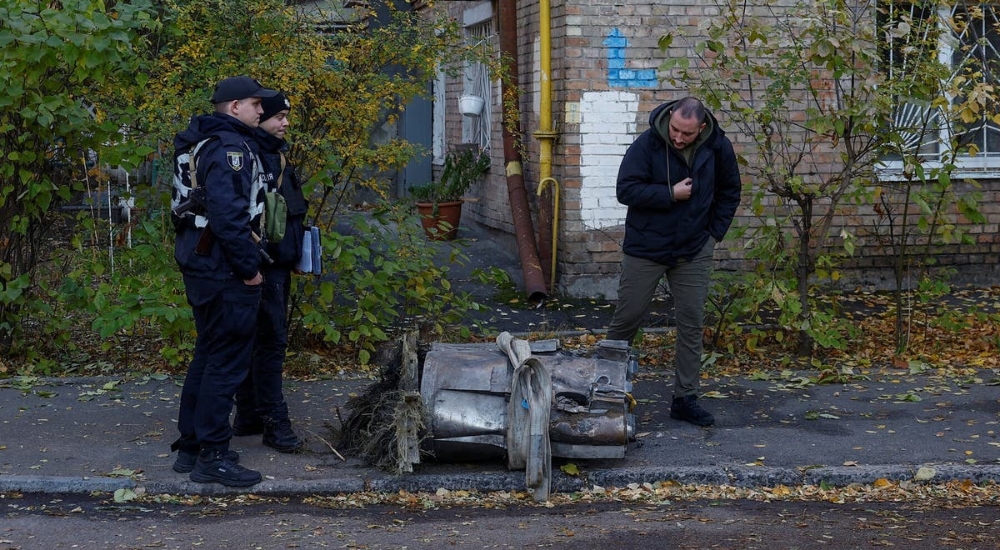 Police officers in Kyiv Ukraine on Sunday with a missile fragment removed 20241117 150421 0000