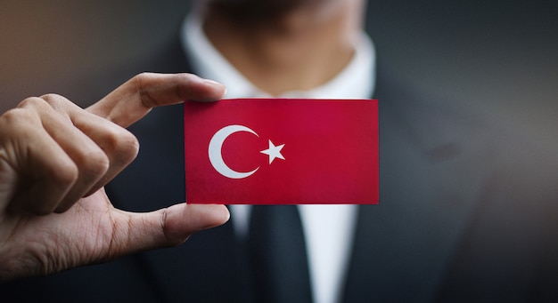 businessman holding card turkey flag 1379 32411