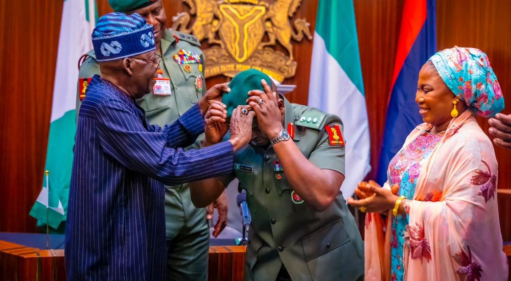 President Tinubu decorates Aide de Camp Lt Col. Nurudeen Alowonle Yusuf with his new rank Colonel to