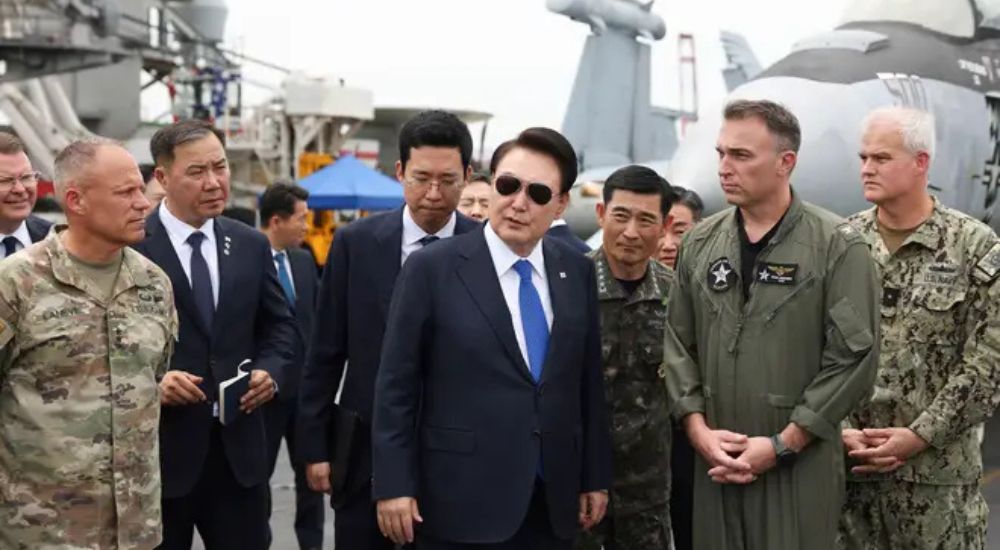 South Korean President Yoon Suk Yeol center boards the USS Theodore Roose 20241203 164517 0000