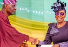 Bola Okikiolu Ighile in a handshake with Governor Sanwo Olu 1200x630