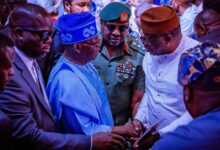 Fayemi shaking hands with President Bola Tinubu at Babangidas book launch 1200x630