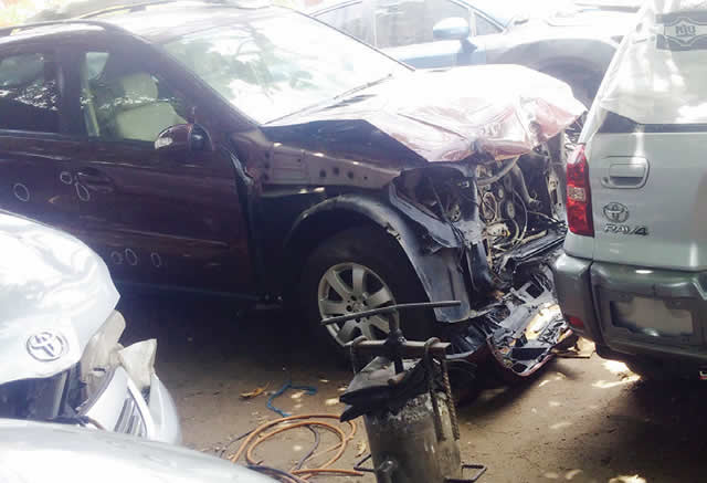 Imported accidented cars being fixed in a workshop