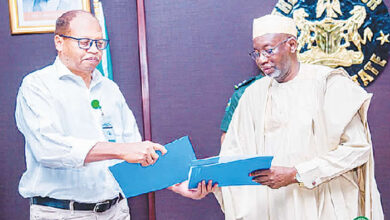 Jigawa Gov Namadi and Chief of the UNICEF Kano Field Office Mr. Mohammed Farah after signing the agr